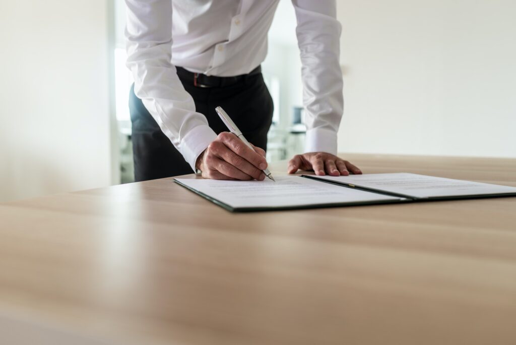Entrepreneur signing document