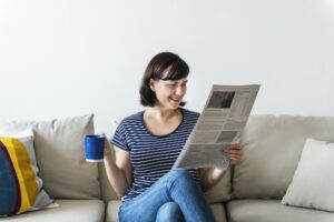 Woman reading newspaper